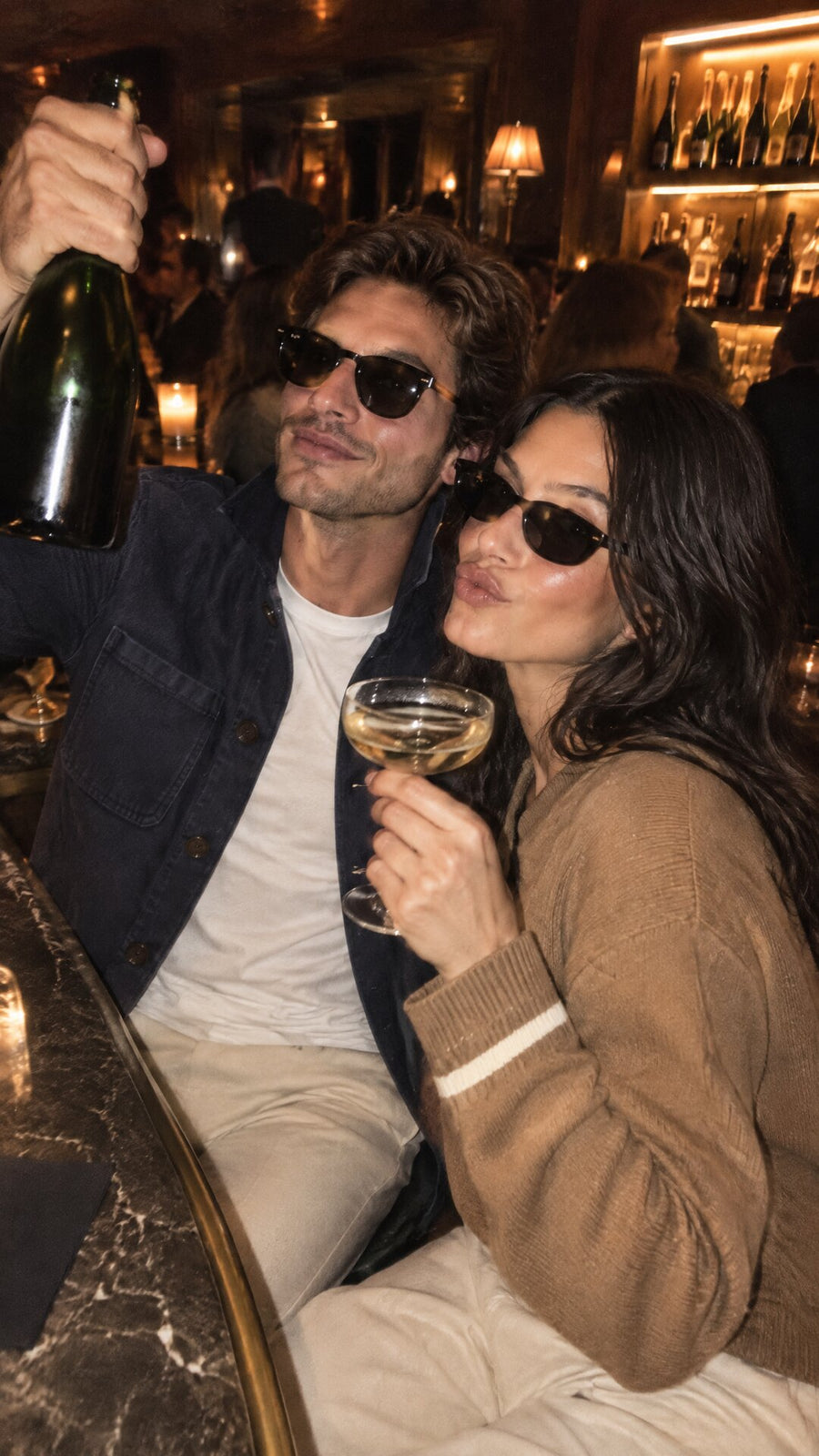 late night at the bar in gstaad, navy overshirt and camel knit