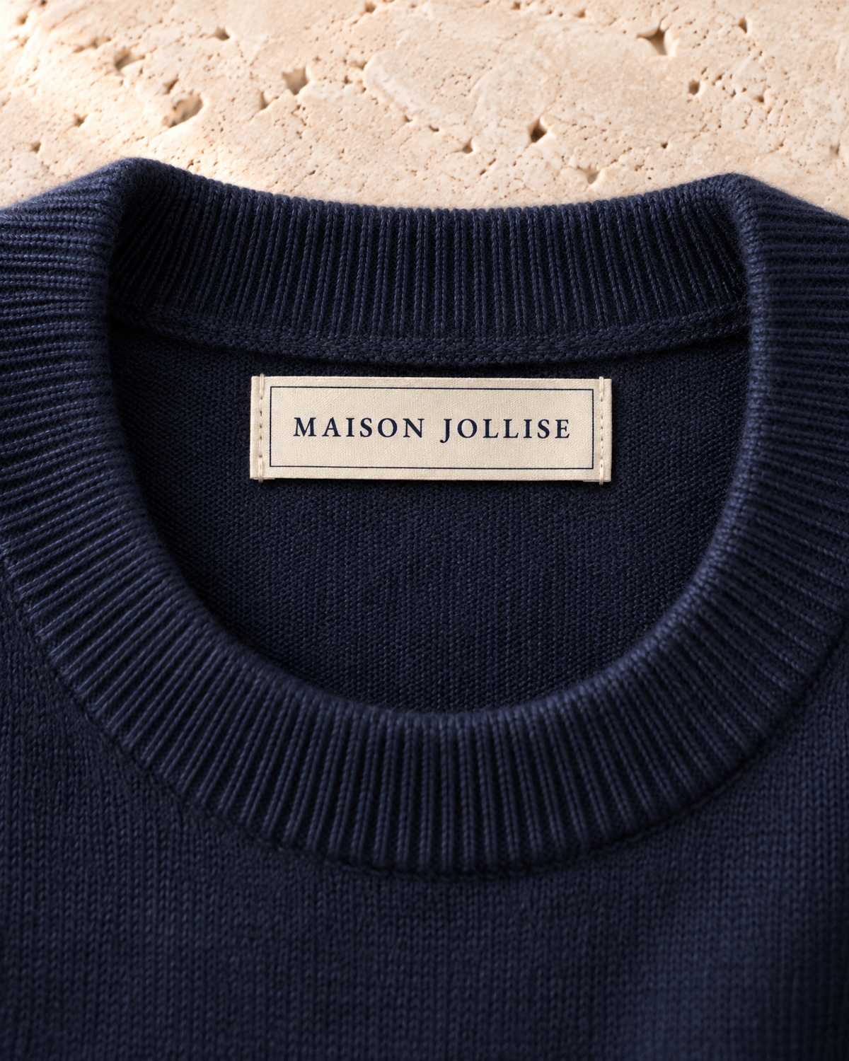 the merino crewneck in navy · östermalm — woven neck label