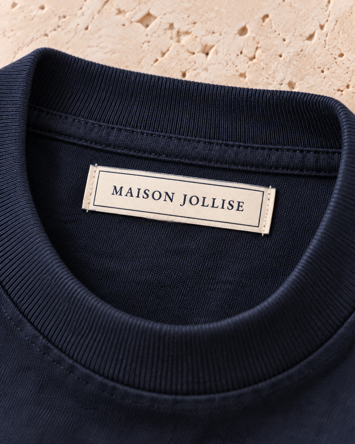 the heavyweight tee in navy · östermalm — woven neck label