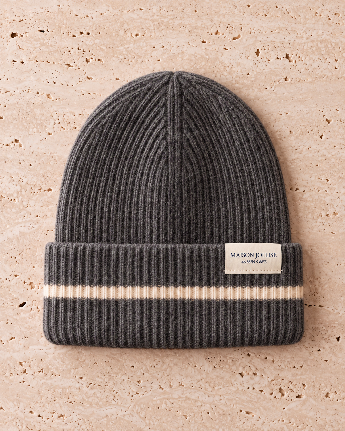 the snow line beanie in charcoal · klosters, laid flat