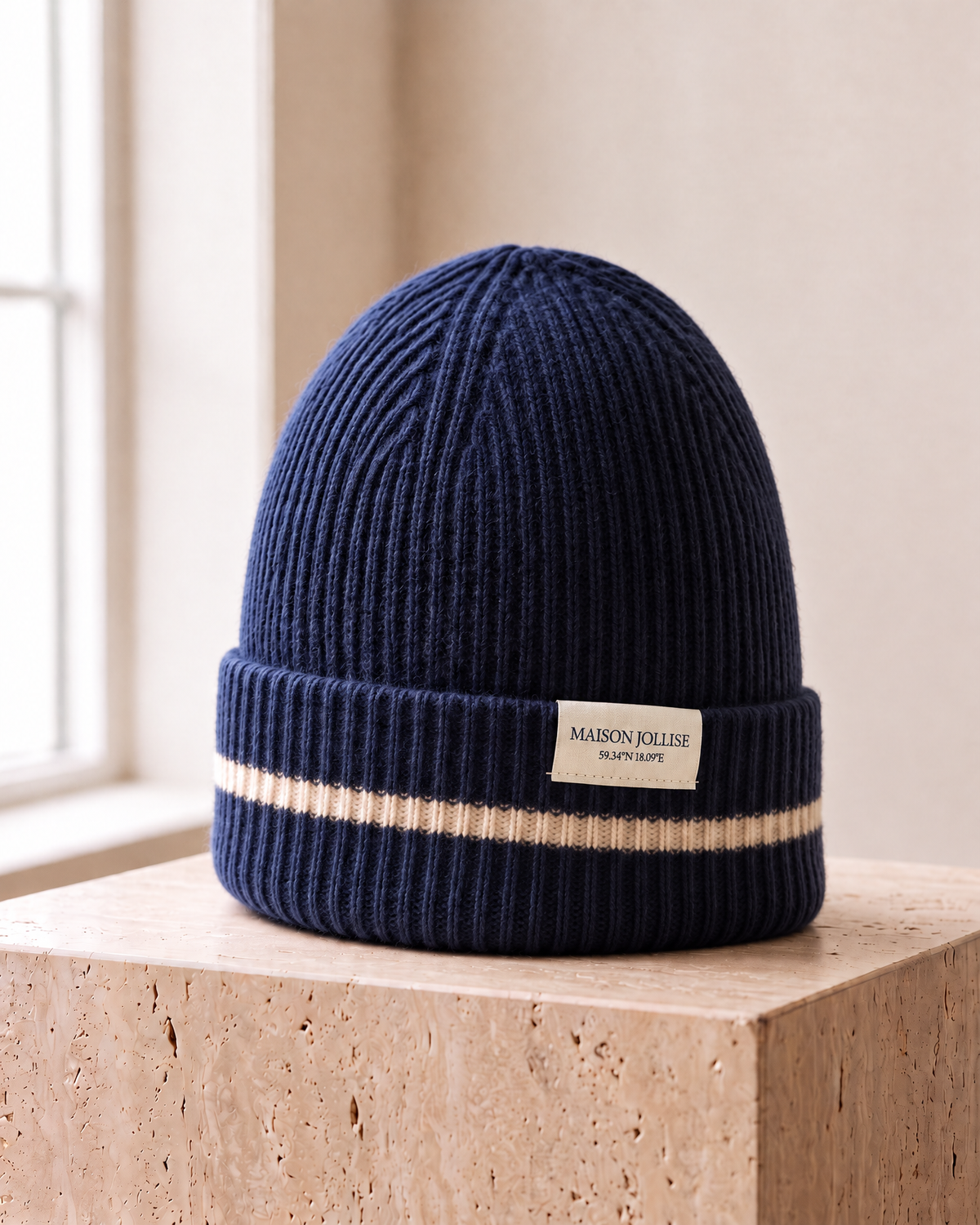 the snow line beanie in navy · östermalm, three-quarter view