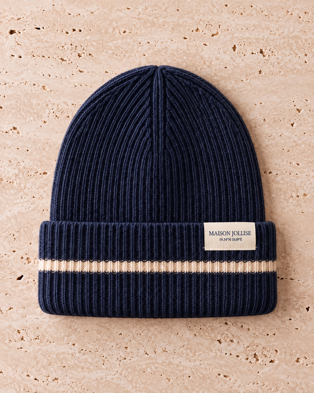 the snow line beanie in navy · östermalm, laid flat