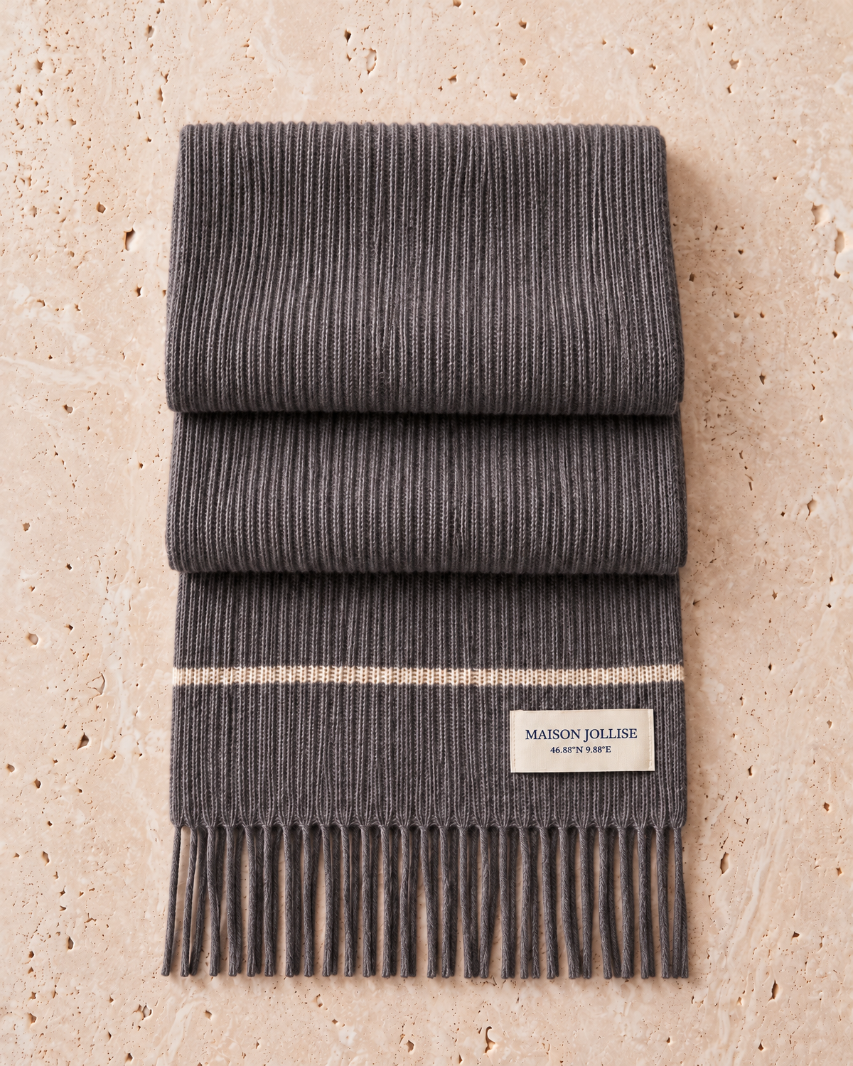 the snow line scarf in charcoal · klosters, folded