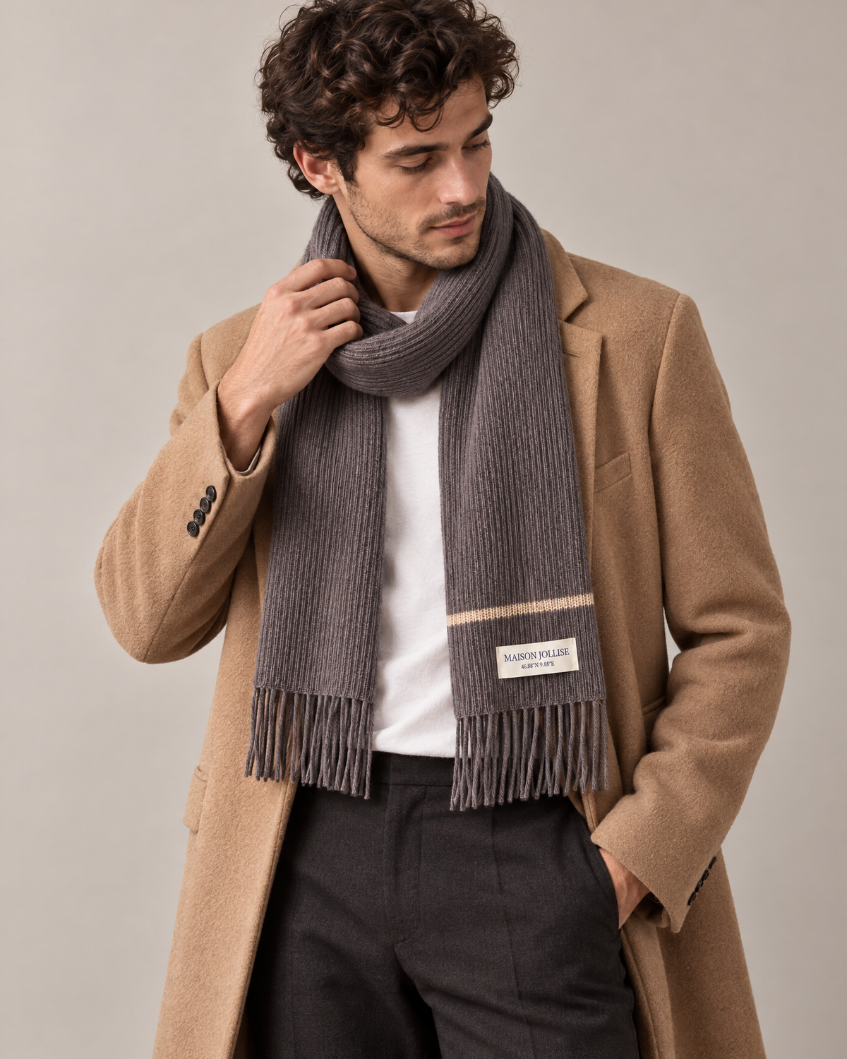 the snow line scarf in charcoal · klosters, worn in the studio