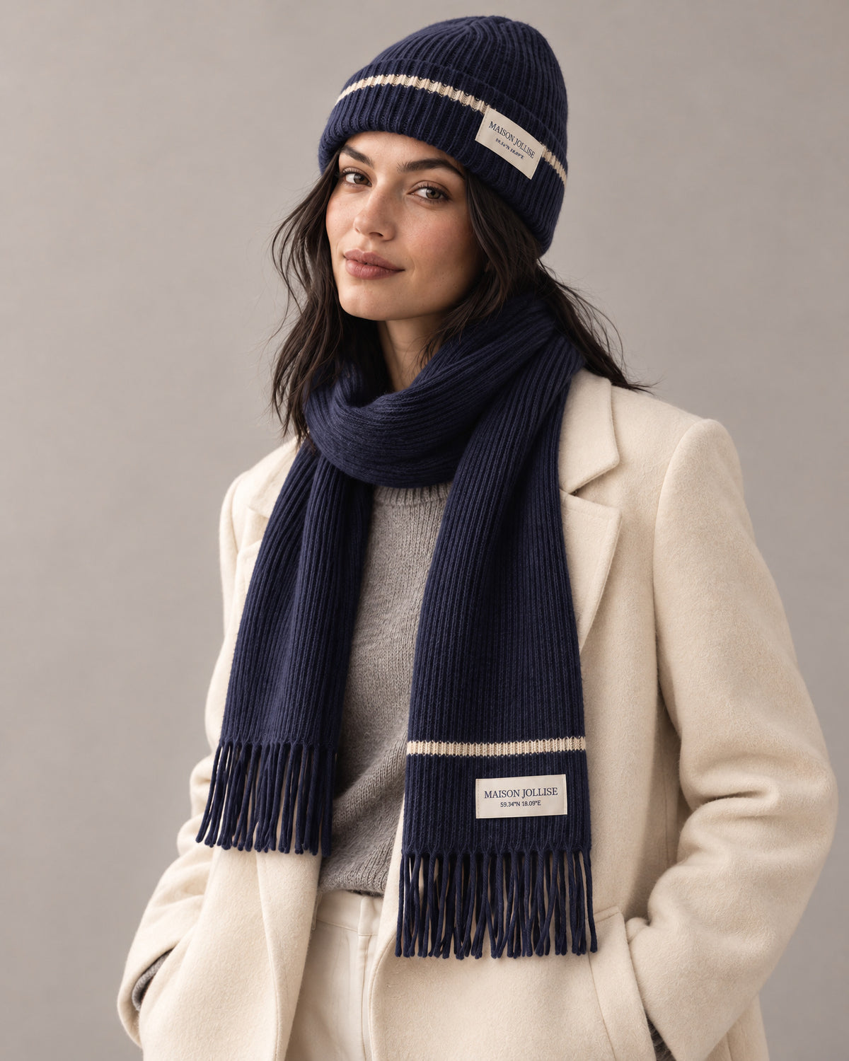 the snow line set in navy · östermalm, beanie and scarf worn together in the studio