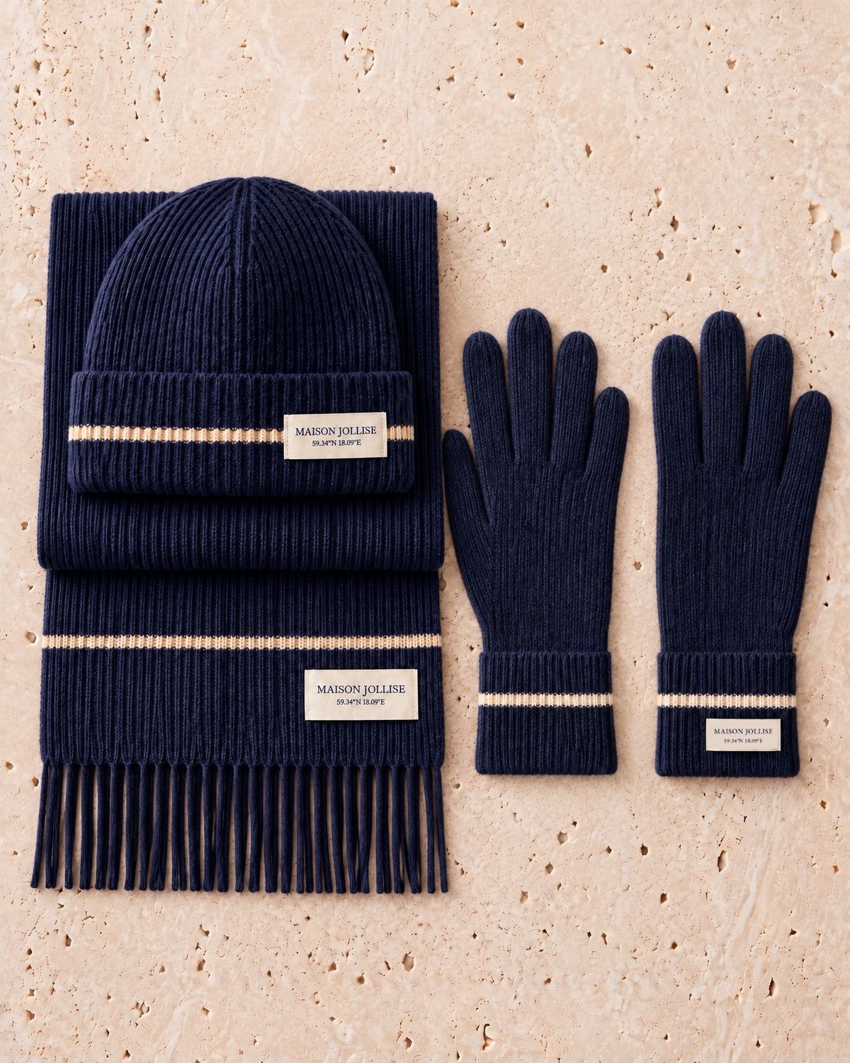 the snow line trio in navy · östermalm — flat lay of the beanie, scarf and gloves